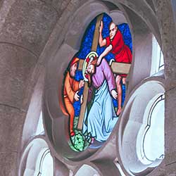 stained glass of Jesus carrying cross