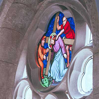 Stained glass with Jesus carrying cross